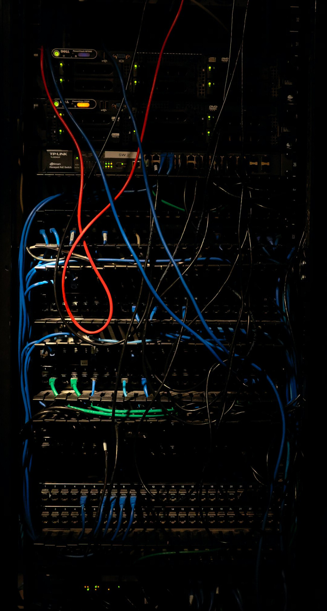 Rows of servers in a data center with blue lights