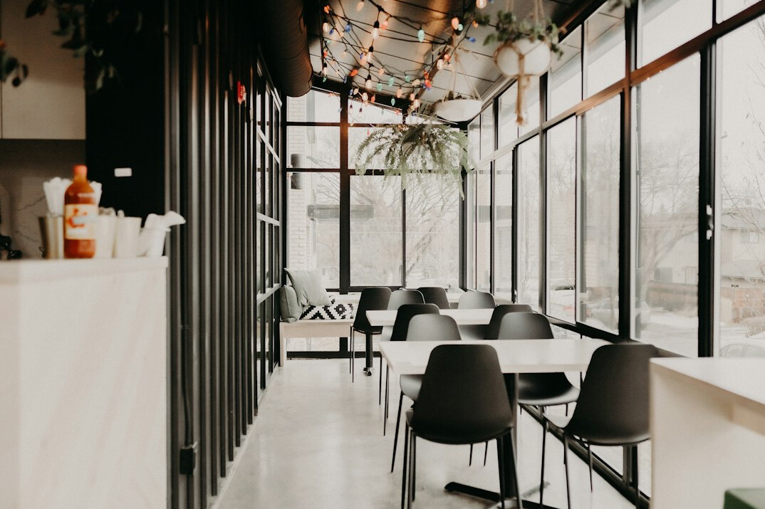 Bright modern open-plan office with desks and large windows